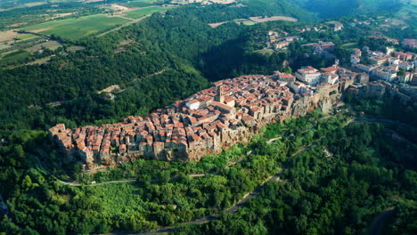 wide aerial shot of the hillside town of pitigliano, tuscany, italy