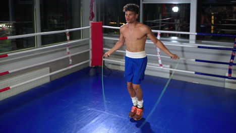 man jumping rope in boxing ring