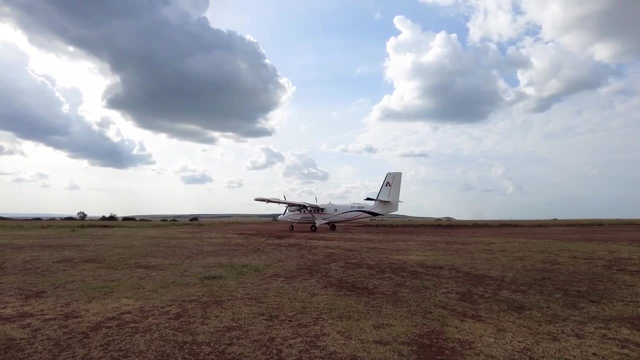Small Airplane on a Grassland Runway in Africa