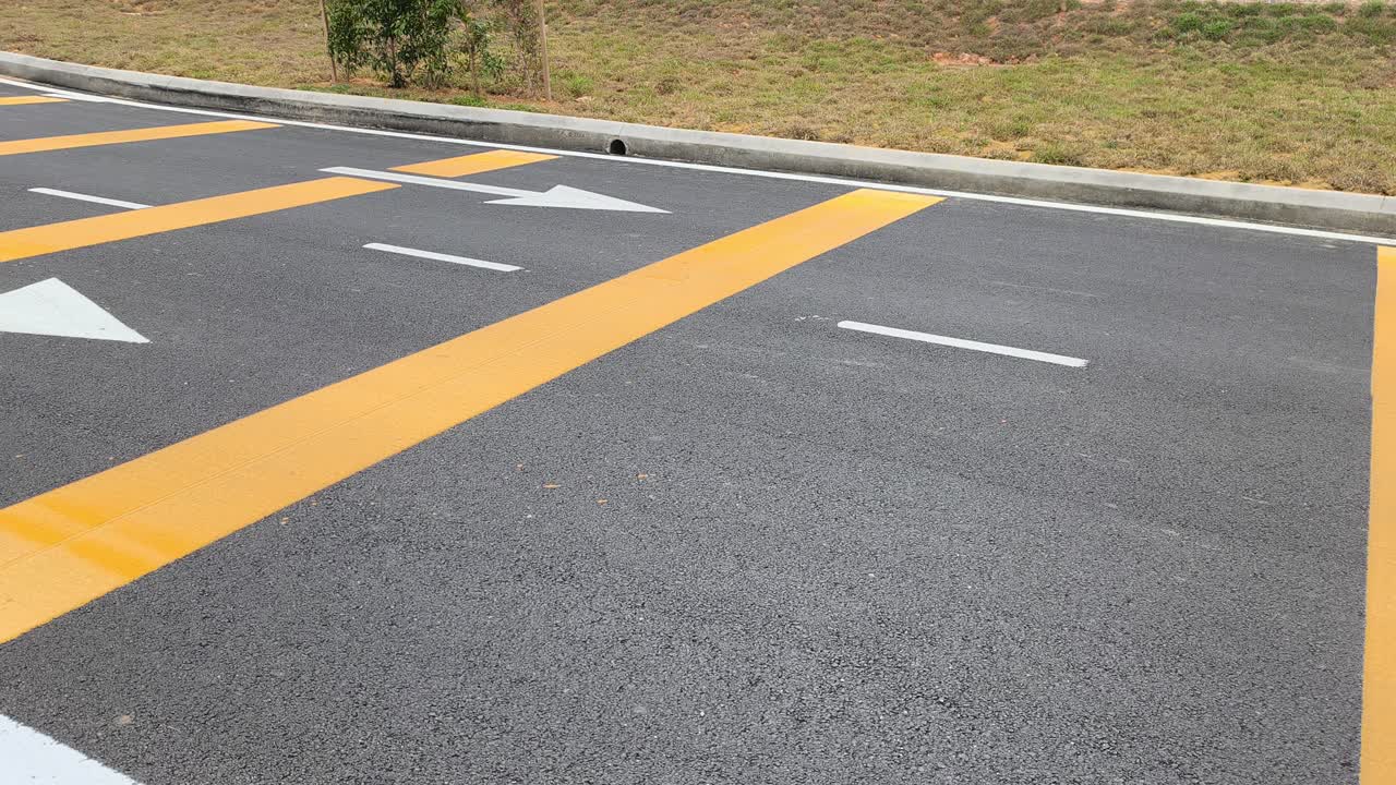 Rumble strips are visible on the roadside. These safety features are ...