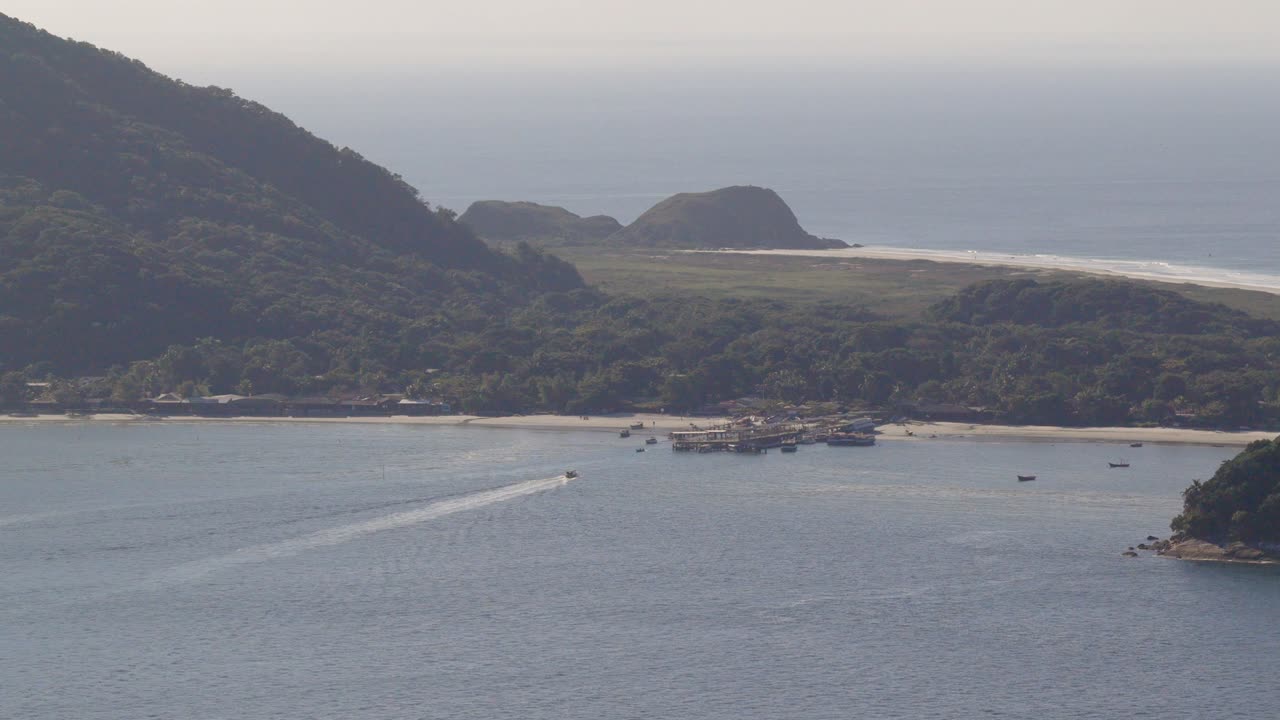 Ilha do Mel island low mountain coastline side with dense forest and ocean environment, Paraná, Brazil