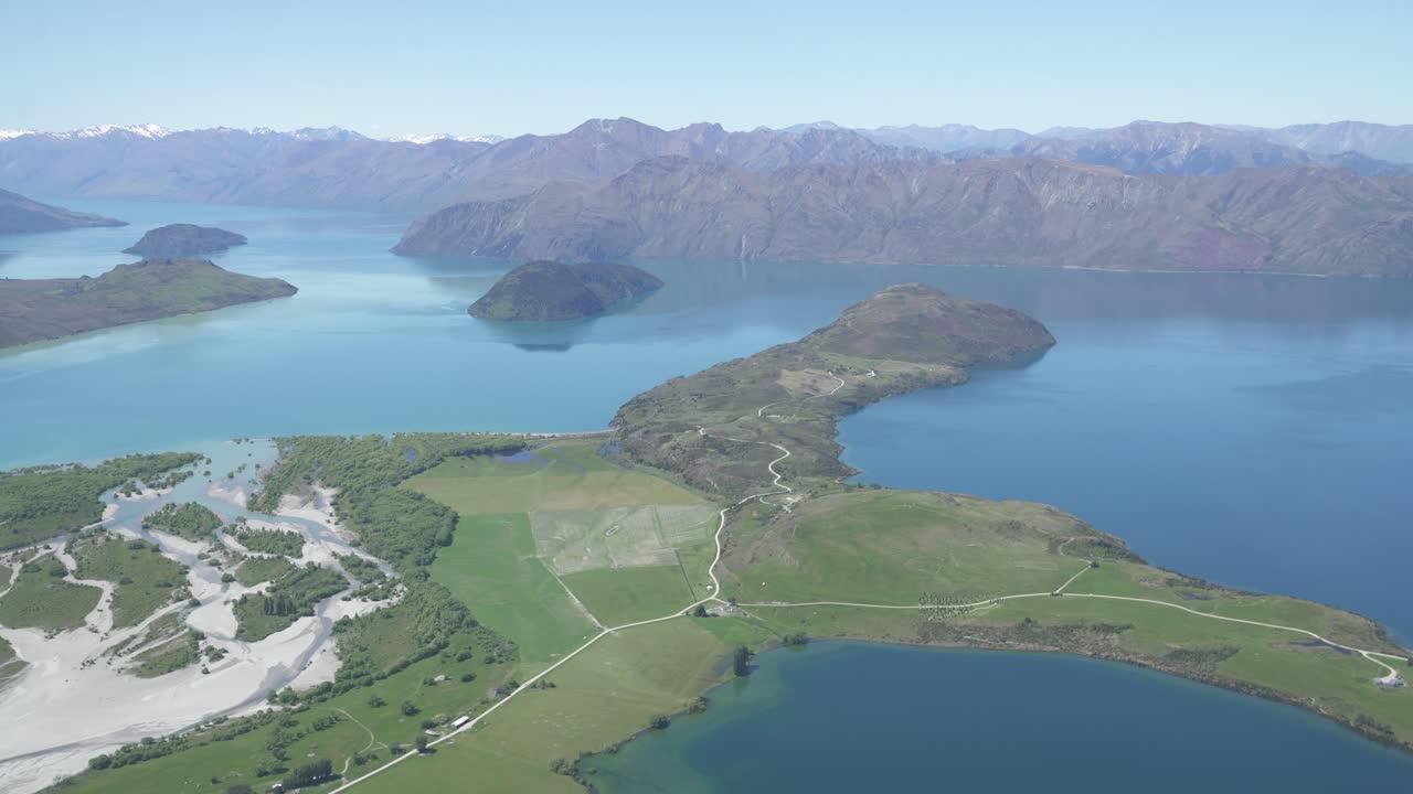 tilting up from the drone of the lakes to the sky