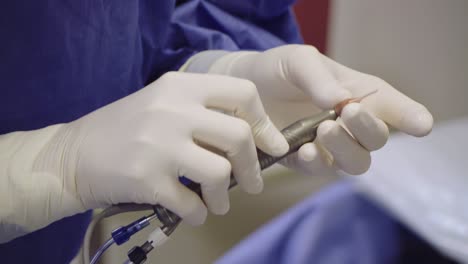 ophthalmologist  preparing quirurgic instrument in quirophan