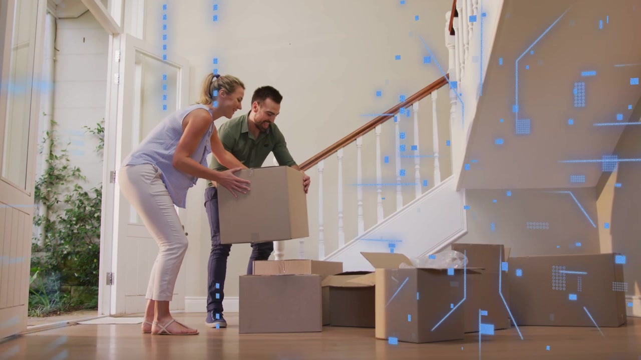 Couple entering placing box onto staging stack while tech overlay animating over pair and boxes