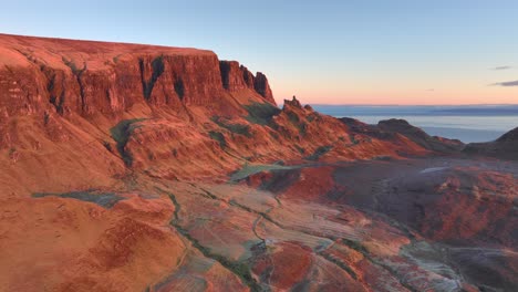 Rocky-and-sharp-cliffs-bathed-in-early-morning-winter-sunrise-light