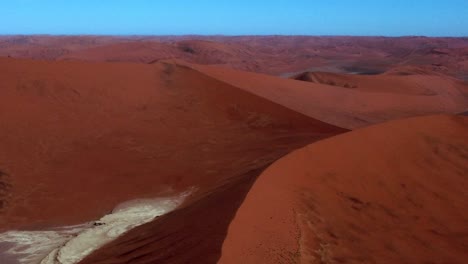 aerial view of sand dunes in a desert landscape