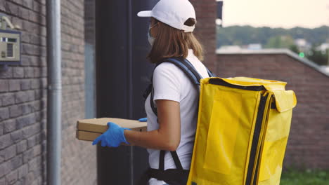 pizza delivery person at a door