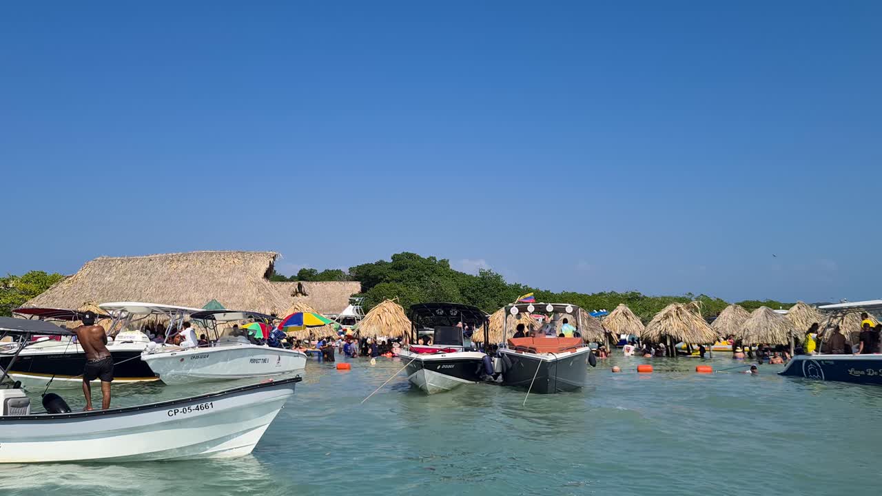 Cholon Party Island in Rosario Archipelago. Cartagena Colombia. People on Boats and Sea Having Fun