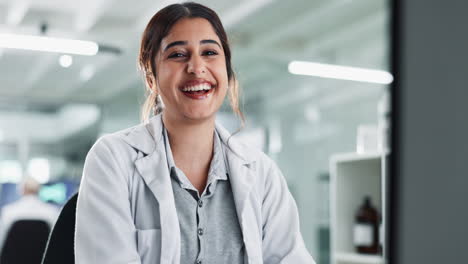portrait of a smiling female scientist in a lab