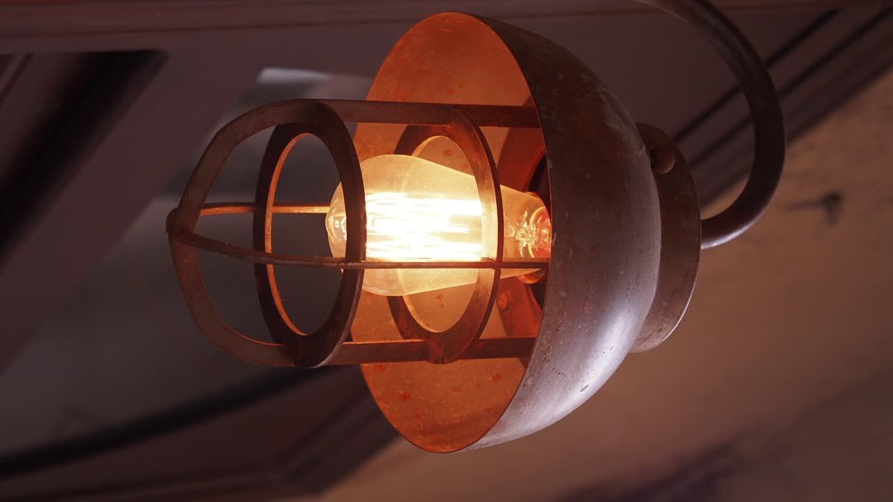 Industrial Light Fixture with Glowing Edison Bulb