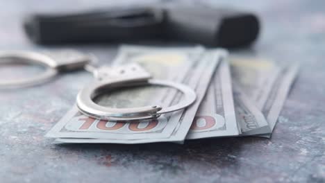 handcuffs, money, and a gun