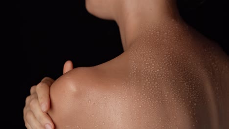woman's back with sweat droplets