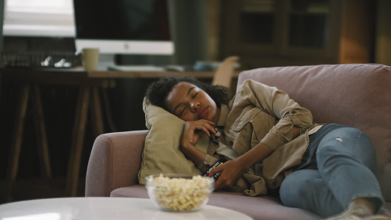 Afro Girl Napping In Front Of TV