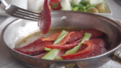 turkish breakfast with sucuk and peppers