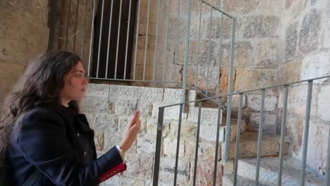 tourist woman taking smartphone selfie at zion gate. slow motion.