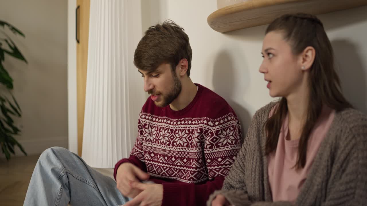 Couple sitting and talking at home
