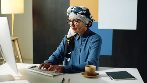 mature biracial woman in office