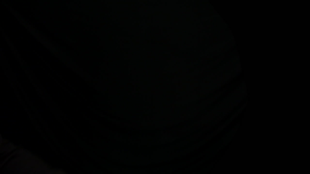 Cocking and firing a 9mm hand gun with black background