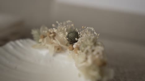 close up of neutral toned dried floral headpiece in soft light