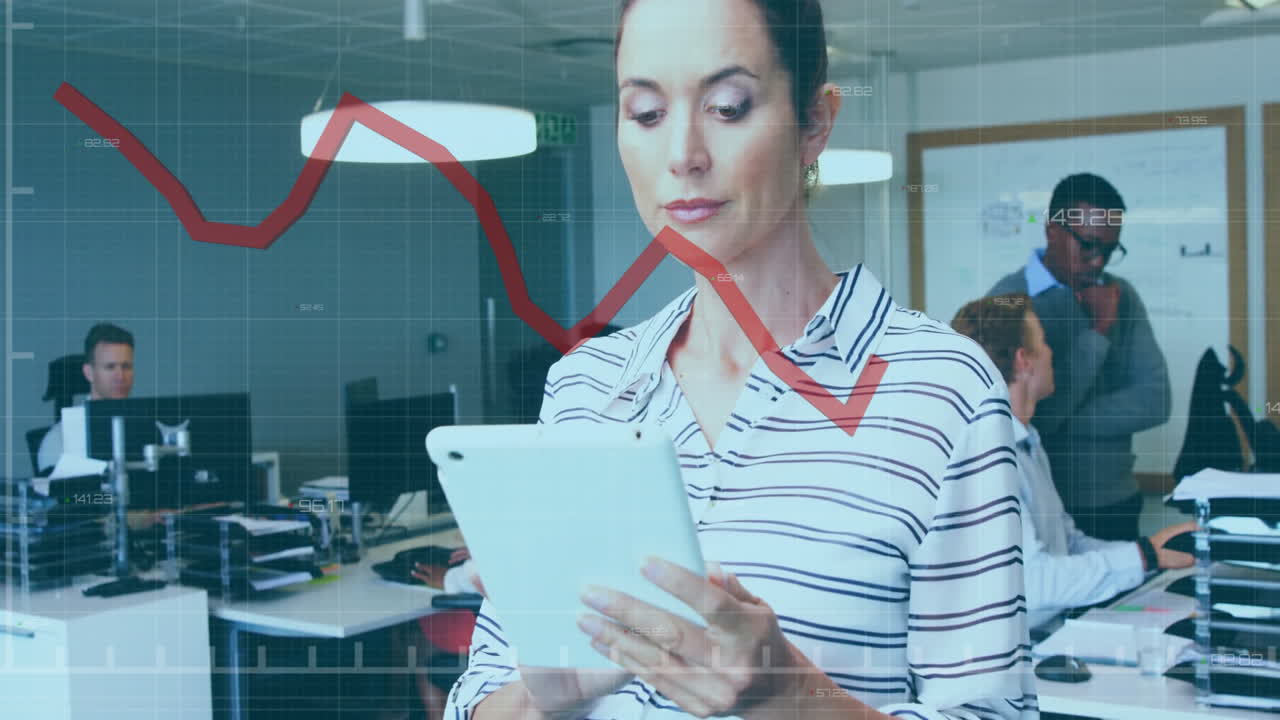 Businesswoman using tablet with financial graph animation over office environment