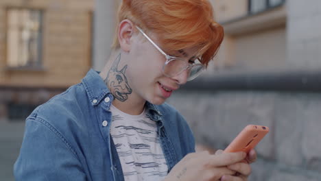 young man using smartphone outdoors