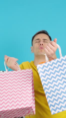 man holding shopping bags