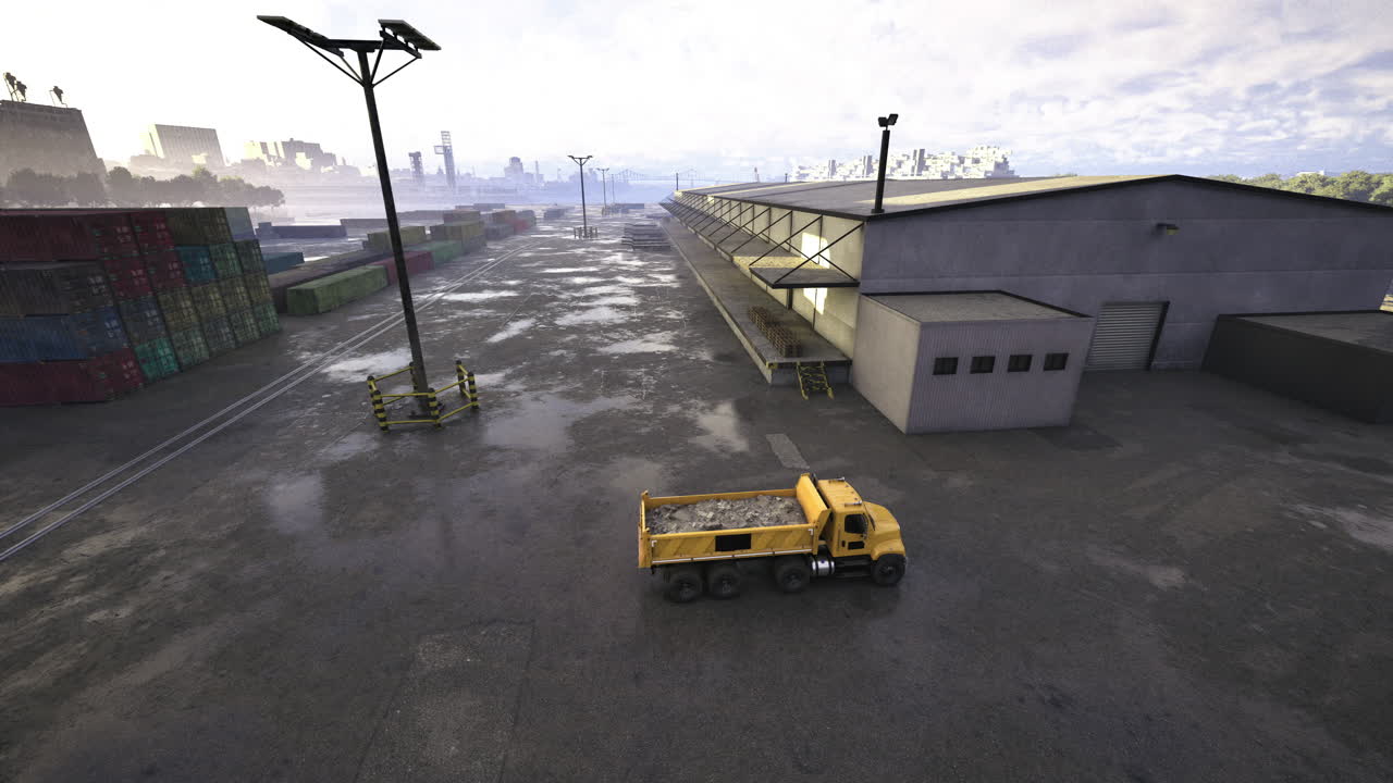 Yellow truck on wet pavement in an industrial area cloudy day