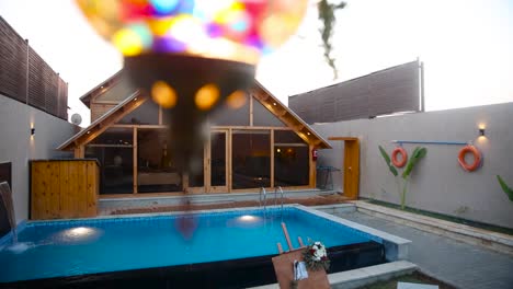 exterior of modern luxurious wooden cabin with large windows. backyard with pool