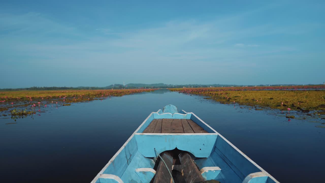 Wooden Boat on a Lotus Pond