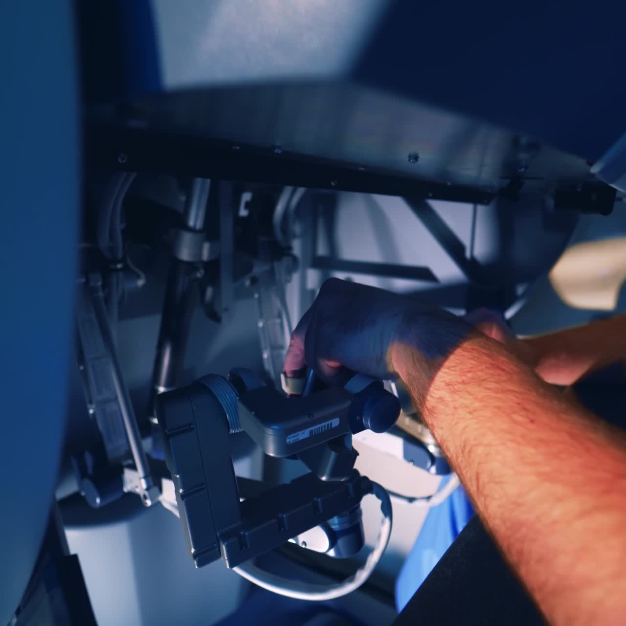 hands of a surgeon at a computer robot. Medical robot. Robotic Surgery.