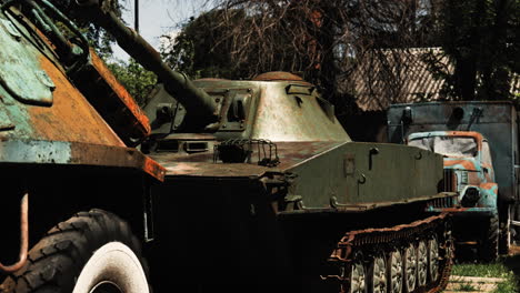 rusted world war ii-era soviet tank on display outdoors, surrounded by convoy vehicles at a historic military site in chișinău, moldova. a glimpse into wartime history and equipment.