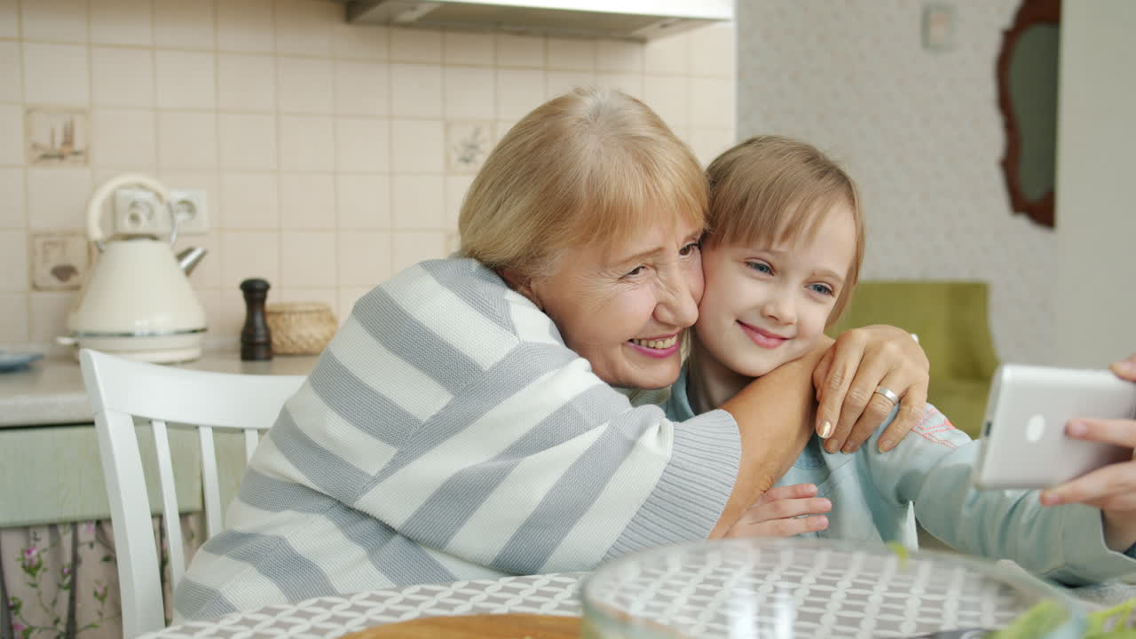 Grandmother and Granddaughter Taking a Selfie