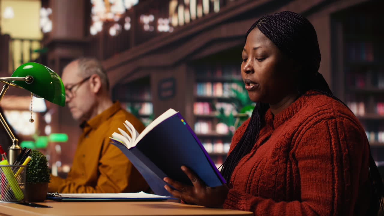 People Reading Books in a Library