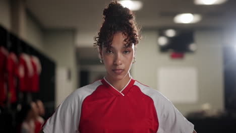 portrait of a female athlete in a locker room