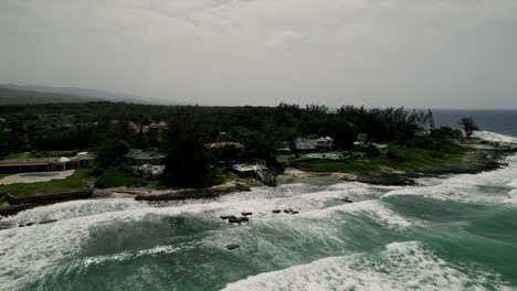 panning aerial tropical beach shot of blue sky turquoise water in st