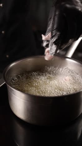 chef deep frying food