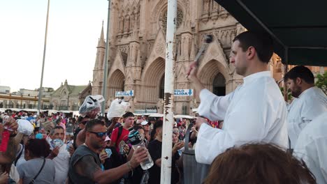 catholic priest blessing with holy water crowds of people's faith at virgin mary our lady of luján neo gothic basilica