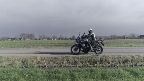 drone shot of motorcyclist driving of