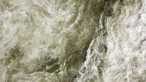 Aerial-drone-top-view-of-the-swirling-and-rushing-water-texture-of-the-Nile-River,-Jinja,-Uganda
