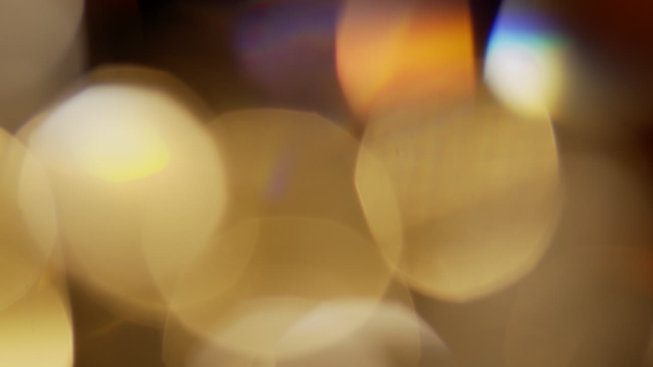 Multicolored light leaks 4k footage on black background. Stylizing video, transitions. Bokeh effect