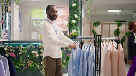 smiling employee in mall clothing store