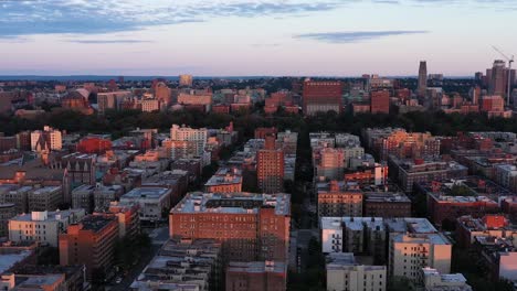 aerial footage over harlem, nyc at golden hour daybreak