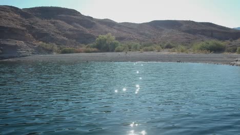 Aerial-flying-along-the-Colorado-River-shoreline-in-Nevada