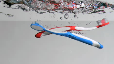 toothbrushes in a super slow motion falling