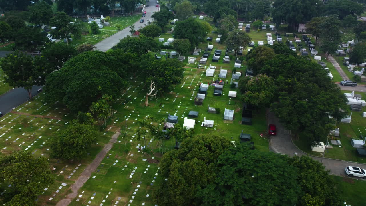 Drone shot over graves at the Manila memorial park, gloomy day in Philippines