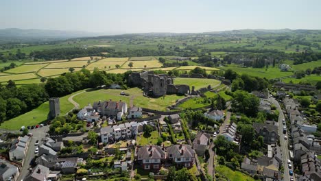 denbigh castle and town walls, denbighshire, wales - aerial drone anti-clockwise distant pan from front to side - june 23