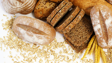 various bread loaves with wheat grains