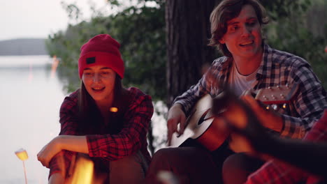 friends singing around a campfire
