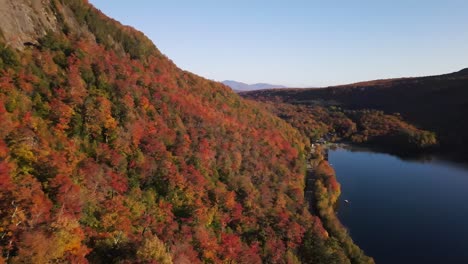 Beautiful-aerial-drone-footage-of-the-fall-leaves-on-and-around-Mount-Hor,-Mount-Pisgah,-and-Lake-Willoughby-during-peak-autumn-foliage-at-Willoughby-State-forest-in-Westmore,-Vermont