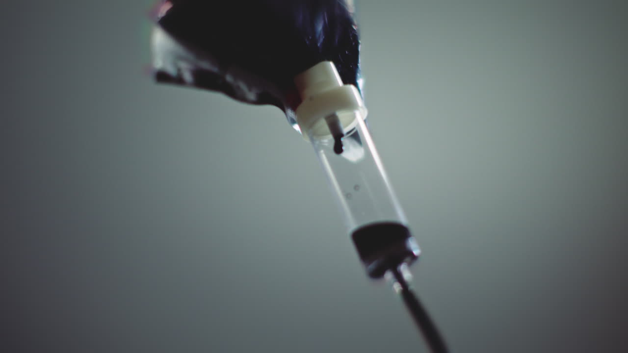 Dark liquid is dripping slowly